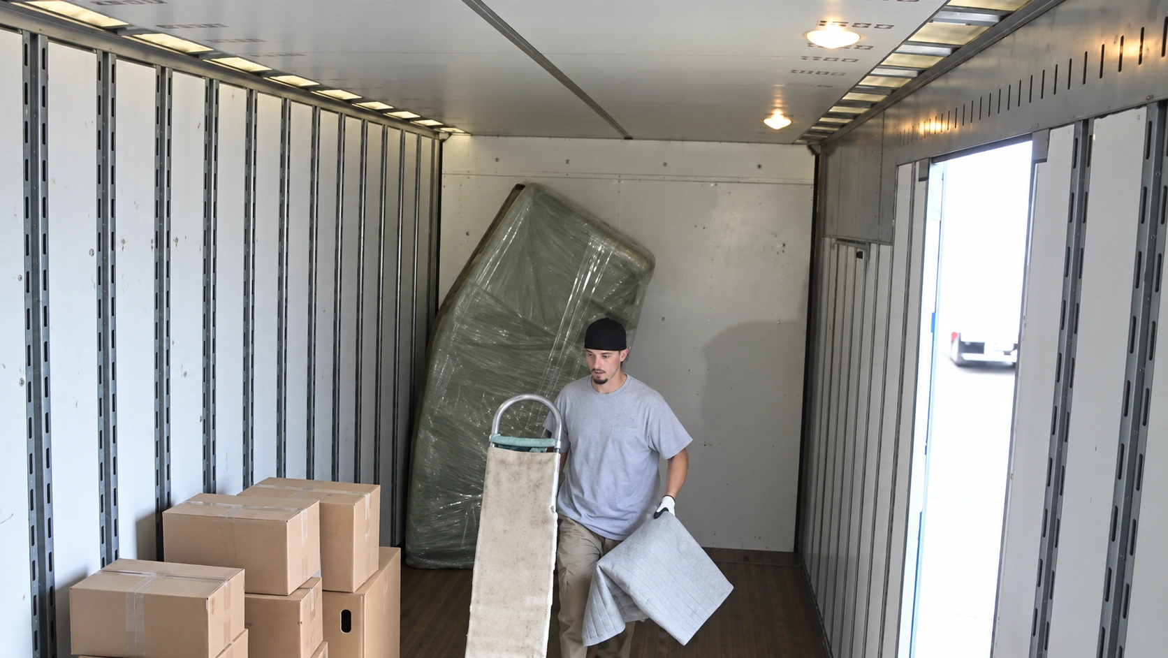 Movers completing a careful unloading sequence